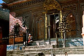 Gokarna Mahadev - the temple entrance with a golden torana with Uma Maheshwar.