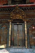 Gokarna Mahadev - the temple entrance with a golden torana with Uma Maheshwar.