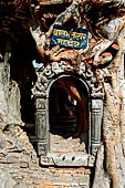 Gokarna Mahadev - shivalayas (lingam shelters) completely taken over by the roots of a pipal tree (ficus religiosa).