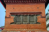 Kathmandu - Durbar Square. Detail of a wooden carved window of the Shiva-Parvati temple