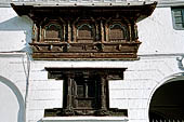 Kathmandu - Durbar Square. Detail of a wooden carved window of the Gaddhi Baithak. 