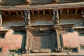 Kathmandu - Durbar Square. Detail of a wooden carved window below Bhagwati temple. 