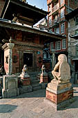 Kathmandu - Durbar Square. Towards the North-east end of the square a small temple dedicated to Vishnu with a statue of Garuda in front marks the start of Makhan Tole the old India-Tibet road.  