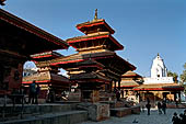 Kathmandu - Durbar Square. The three levels roof Vishnu Temple, on the background the white spire of Kakeshwar temple.