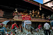Kathmandu - Indra Chowk major crossroads with the temple of Akash Bhairab with four metal lions that lean out from the balcony.