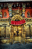 Pashupatinath Temple (Deopatan) - the southernmost courtyard of the complex, the small pagoda temple of Nawa Durga with brightly coloured roof strut.