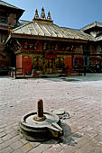 Pashupatinath Temple (Deopatan) - the small pagoda temple of Nawa Durga in the southernmost courtyard of the complex, a Shiva Lingam in the foreground.