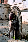 Pashupatinath Temple (Deopatan) - Buddha Statue (6th c.) in front of steps on the east side of the Raja Rajeshvari Mandir near the outer wall.