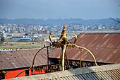 Pashupatinath Temple (Deopatan) - Ghujeshwari Mandir. The temple cannot be seen from the outside apart from the four gilded snakes supporting its roof.