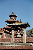 Patan Durbar Square - Taleju bell, behind on the background the Taleju temple of the Royal Palace.