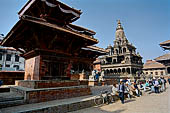 Patan Durbar Square - Krishna Mandir with in the foreground one minor pagoda temple dedicated to Vishnu 