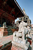 Patan Durbar Square - Narayan Temple, the stone lions guarding the East entrance. 