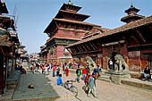 Patan Durbar Square - The Royal Palace with Dejutaleju temple, on the right, guarded by two stone lions, the entrance to the Mul Chowk. 