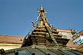 Patan  - The Golden Temple, the small pagoda inside the courtyard, four nagas support a small pinnacle with the 13 rings. 