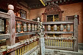 Patan  - The Golden Temple, statues of monkey which hold out jackfruits as an offering at the corners of the courtyard. 