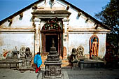 Swayambhunath Stupa - the temple of Santipura, the door is flanked by lion and tiger headed dakinis and a Buddha Shantipura statue.