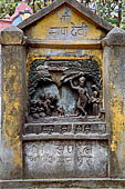 Swayambhunath - bas-relief  of the eastern stairway ascending the hill representing the born of Buddha.