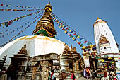 Swayambhunath - The stupa with at the sides white shikhara temples.