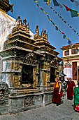 Swayambhunath - On each side of the stupa the elaborately decorated gilt copper shrines of the five Buddha.