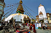 Swayambhunath - The stupa with at the sides white shikhara temples.