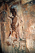 Hirapur - the Sixtyfour Yoginis Temple, male image on the left side wall of the vestibule. Note the anklets of snakes and the attendands holding skull-cups.