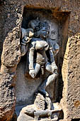 Hirapur - the Sixtyfour Yoginis Temple, Yogini n 42 (clockwise), four armed figure mounted on two wheels and a mungoose. She holds a damaru on her right hand.