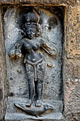 Hirapur - the Sixtyfour Yoginis Temple, Yogini n 37 (clockwise), two armed figure mounted on a crow. She has a sword on her right hand. Note the intricate design of her cloths.