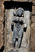 Hirapur - the Sixtyfour Yoginis Temple, Yogini n 54 (clockwise), two armed figure mounted on a wooden cot.