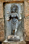 Hirapur - the Sixtyfour Yoginis Temple, Yogini n 14 (clockwise), two armed figure standing on a drum.