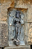 Hirapur - the Sixtyfour Yoginis Temple, Yogini n 17 (clockwise), four armed figure standing on severed head and holding a bow.