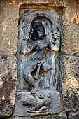 Hirapur - the Sixtyfour Yoginis Temple, Yogini n 20 (clockwise), mounting on a lion she lifts an elephant skin oner her head.