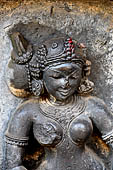 Hirapur - the Sixtyfour Yoginis Temple, head detail of Yogini n 24 (clockwise). Her braid is on the right and she is wearing a mukuta.