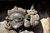 Hirapur - the Sixtyfour Yoginis Temple, head detail of Yogini n 49 (clockwise), note the large braid to the left of her head.