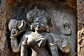 Hirapur - the Sixtyfour Yoginis Temple, head detail of Yogini n 42 (clockwise) with a damaru on her right hand.