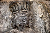 Hirapur - the Sixtyfour Yoginis Temple, head detail of Yogini n 28 (clockwise) with protuding lips and curling hair.