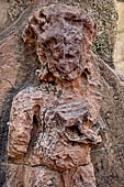 Hirapur - the Sixtyfour Yoginis Temple, the temple entrance, northern Dvarapala holding a skull cuo in his left hand.