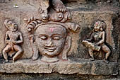 Hirapur - the Sixtyfour Yoginis Temple, pedestal of Katyayani n 1 (clockwise) with two male attendants beating drums.