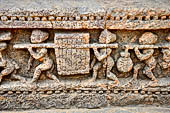 Orissa - Konarak - The Sun Temple. The frieze which runs continously all  around the base of the temple platform, decorated with more than ten thousands elephants .  