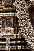 Konarak - Orissa. The Sun Temple, details of the twelve pairs of the great wheels arrayed along the platform.  