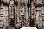 Orissa - Bhubaneswar, Lingaraj Temple. Decoration of the deul, the central bho motif can be noted among the miniature temples (angasikharas). 