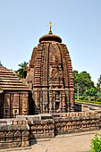 Orissa - Bhubaneshwar. Mukteswara temple, the low wall that contours the temple can be observed in the foreground. 