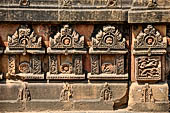 Orissa - Bhubaneshwar. Mukteswara temple, detail of the low wall that contours the temple. 