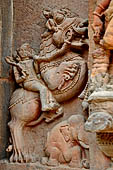 Orissa - Bhubaneshwar. Mukteswara temple, simha virala dragon with lion's head standing over a recumbent elephant with a knight raiding the monster. 