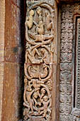 Orissa - Bhubaneshwar. Mukteswara temple, the large latticed window on the side of the jagmohana with all around figurines of lice-picking monkeys. 