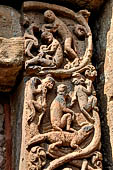 Orissa - Bhubaneshwar. Mukteswara temple, the large latticed window on the side of the jagmohana with all around figurines of lice-picking monkeys. 