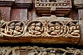 Orissa - Bhubaneshwar. Mukteswara temple, the large latticed window on the side of the jagmohana with all around figurines of lice-picking monkeys. 