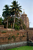 Orissa - Bhubaneswar. Papanashini Kund with the Lingaraj temple in the background. 