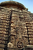 Orissa - Bhubaneswar. Parsurameswar Temple,detail of the western 'rahapaga', the central projection of the deul, in the 'chaitya' medallion the relief of Shiva Nataraja, above the image of Lakulisa. 