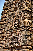 Orissa - Bhubaneswar. Parsurameswar Temple, the 'rahapaga', the western central projection of the deul, in the large 'chaitya' medallion the relief of Ravana shaking mount Kailash, above Shiva Nataraja. 