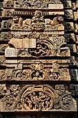 Orissa - Bhubaneswar. Parsurameswar Temple, 'rahapaga', the central projection of the southern face of the deul, in the medallion: Shiva begs food from Parvati. 